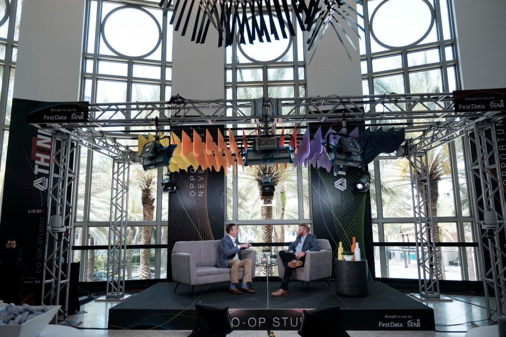 men onstage speakers conference business miami lowes