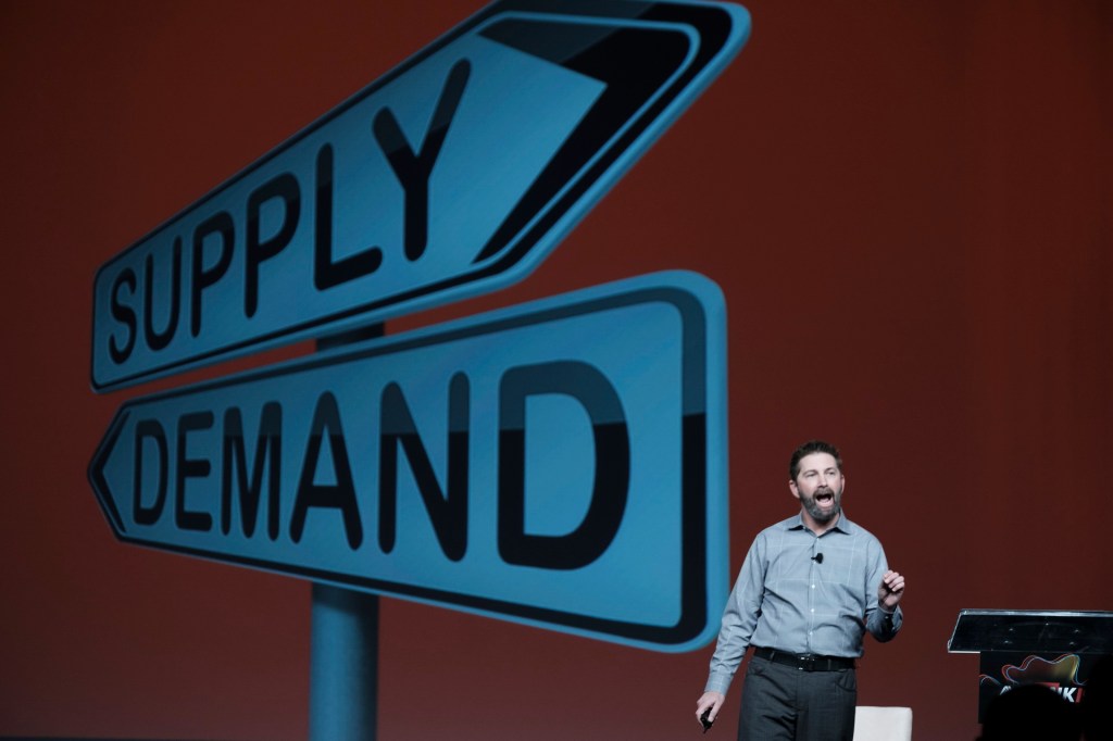 speaker onstage miami lowes business conference