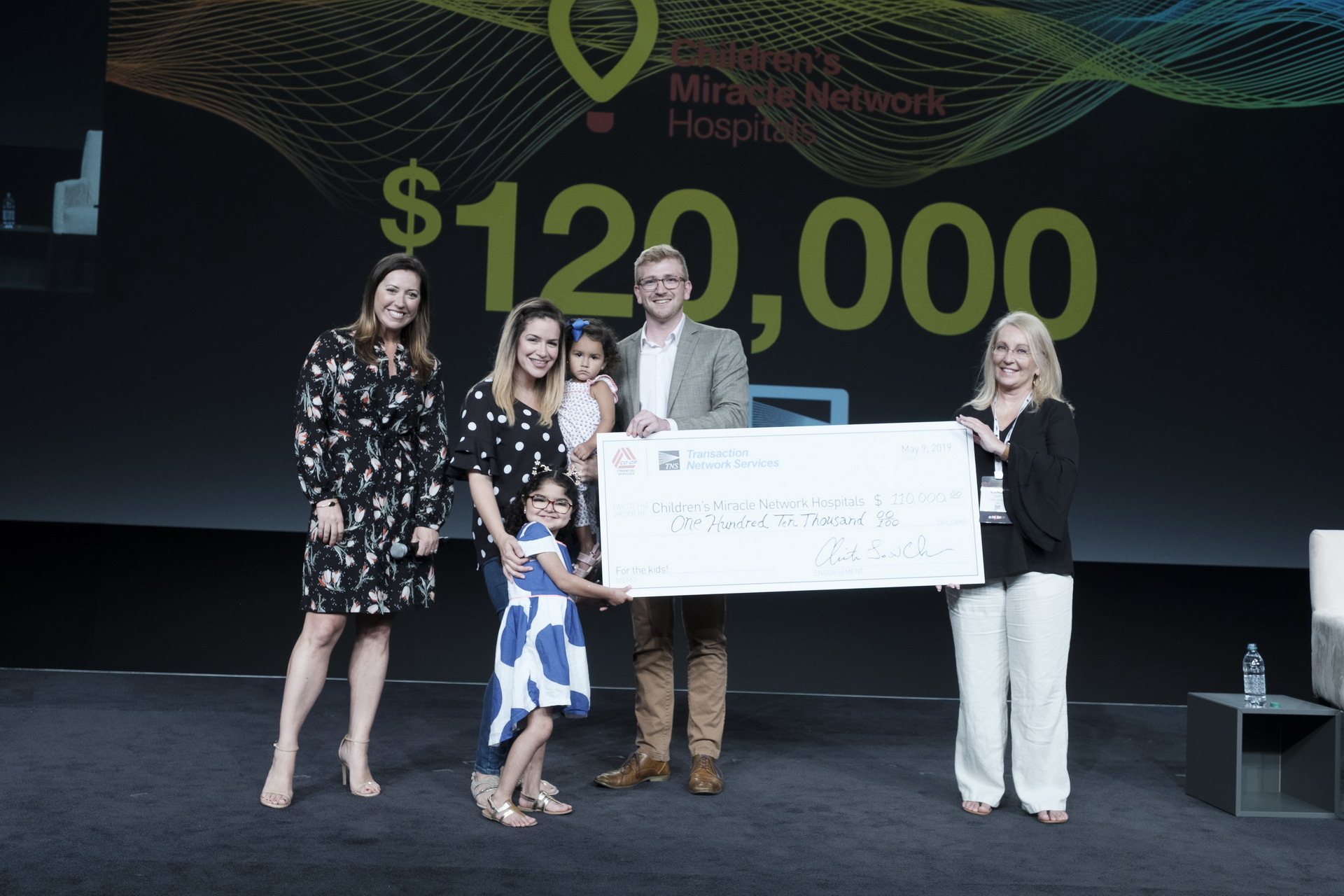 large check presentation business corporate conference seminar