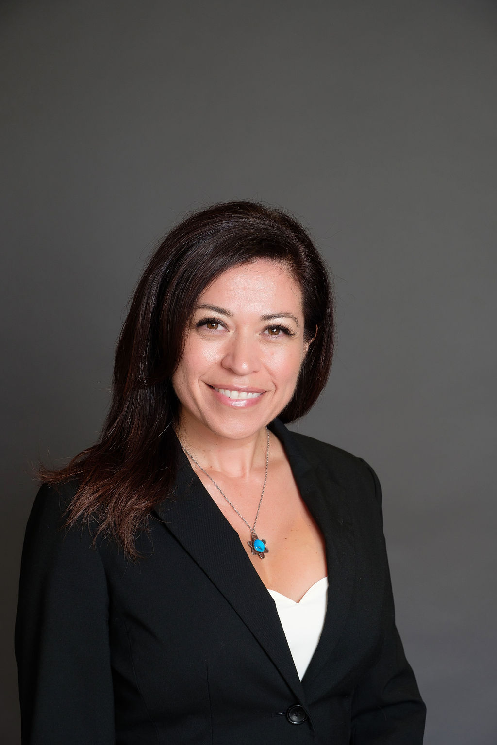 relaxed business headshot enviornmental portrait grey backdrop