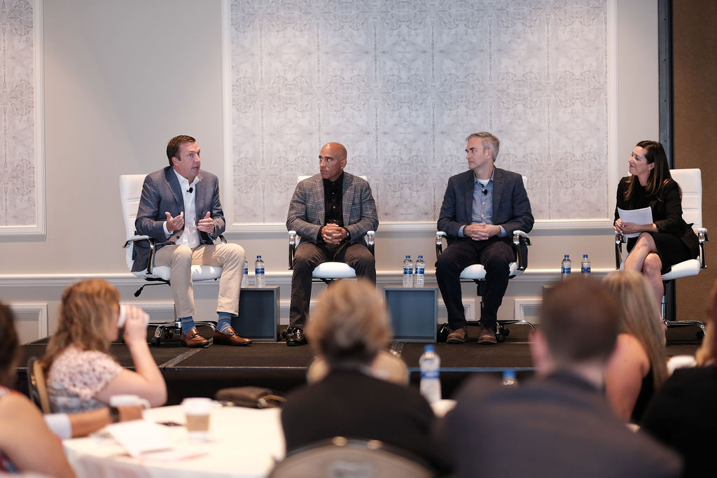 speakers onstage business conference huntingon beach hyatt