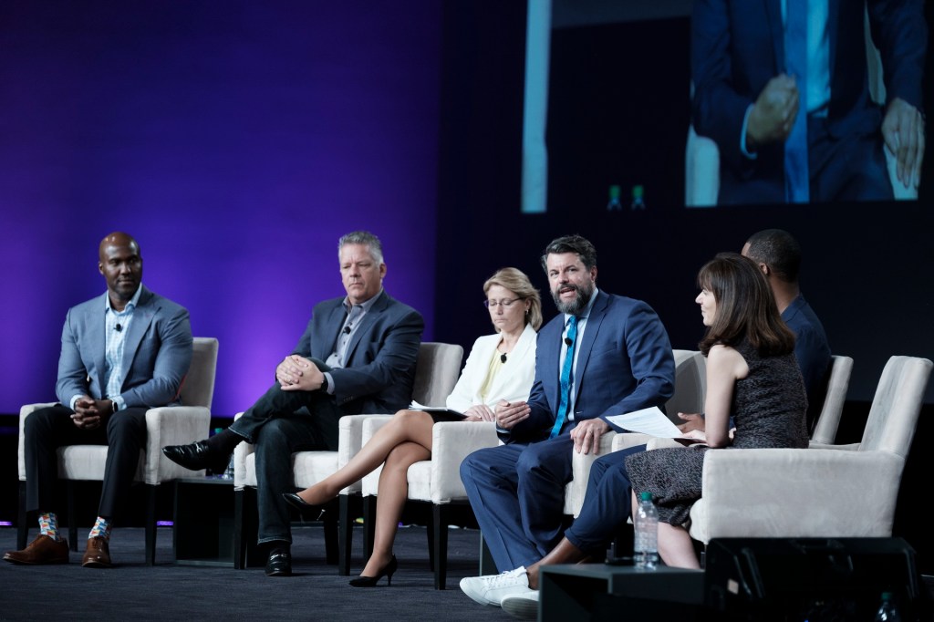 expert panel onstage business conference miami beach loes hotel