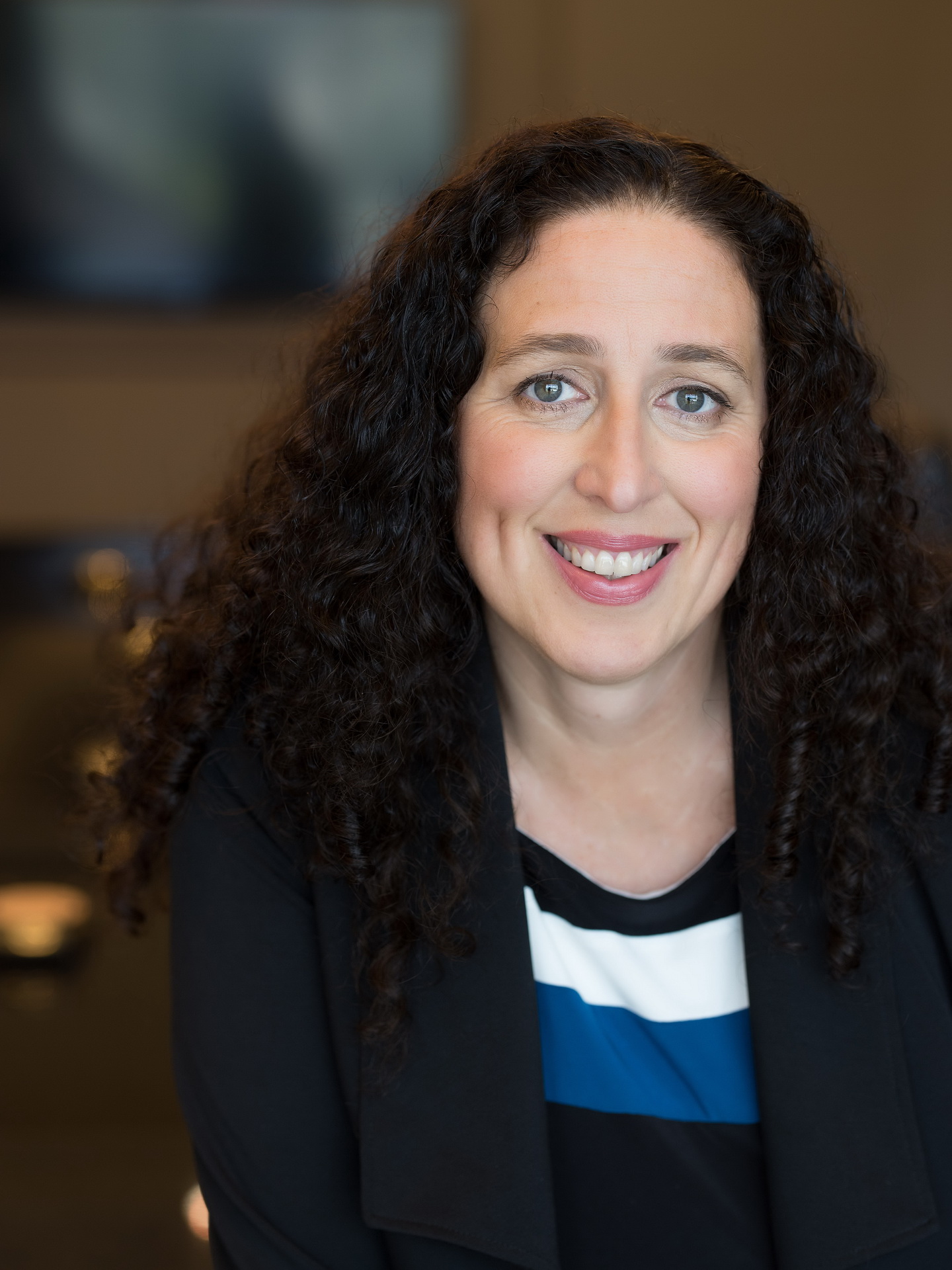 relaxed business headshot enviornmental portrait boardroom