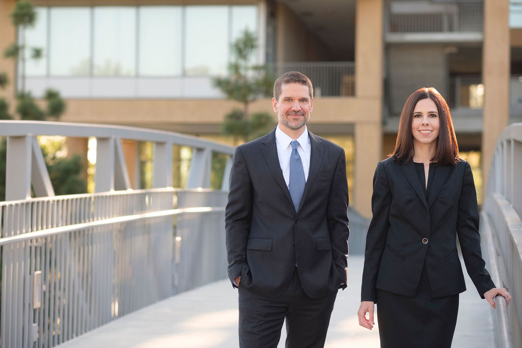 business attorney headshots modern glass architecture blurred background