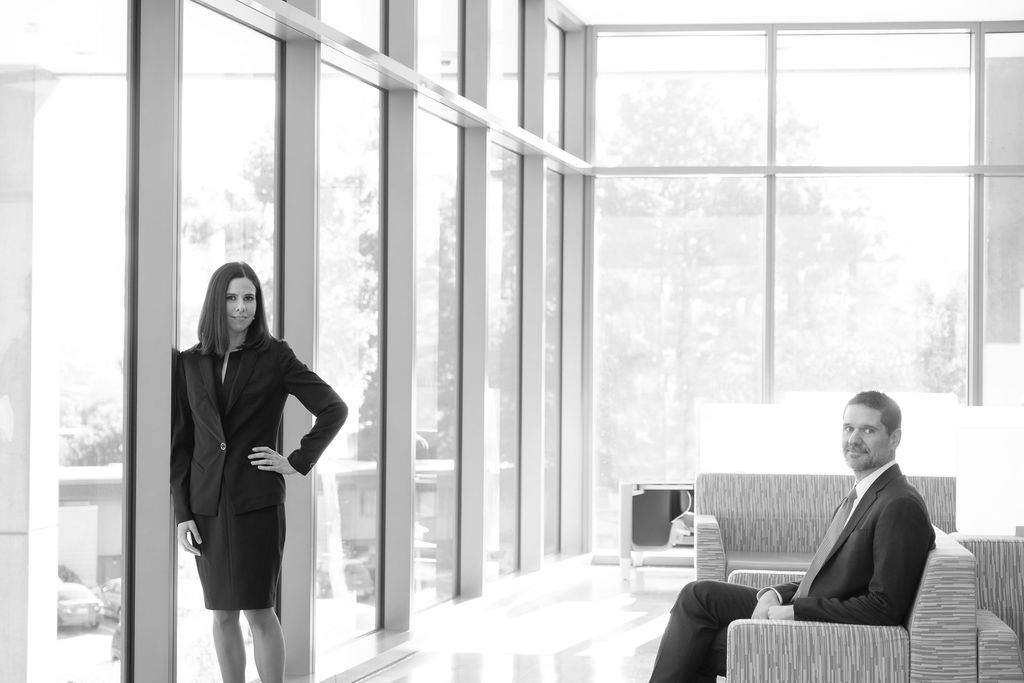 business attorney headshots modern glass architecture blurred background