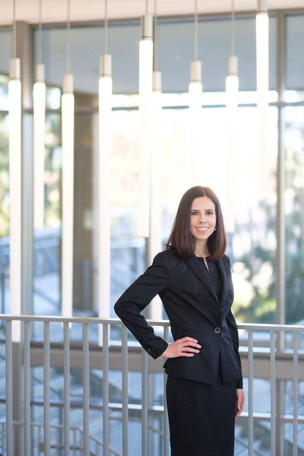 business attorney headshots modern glass architecture blurred background