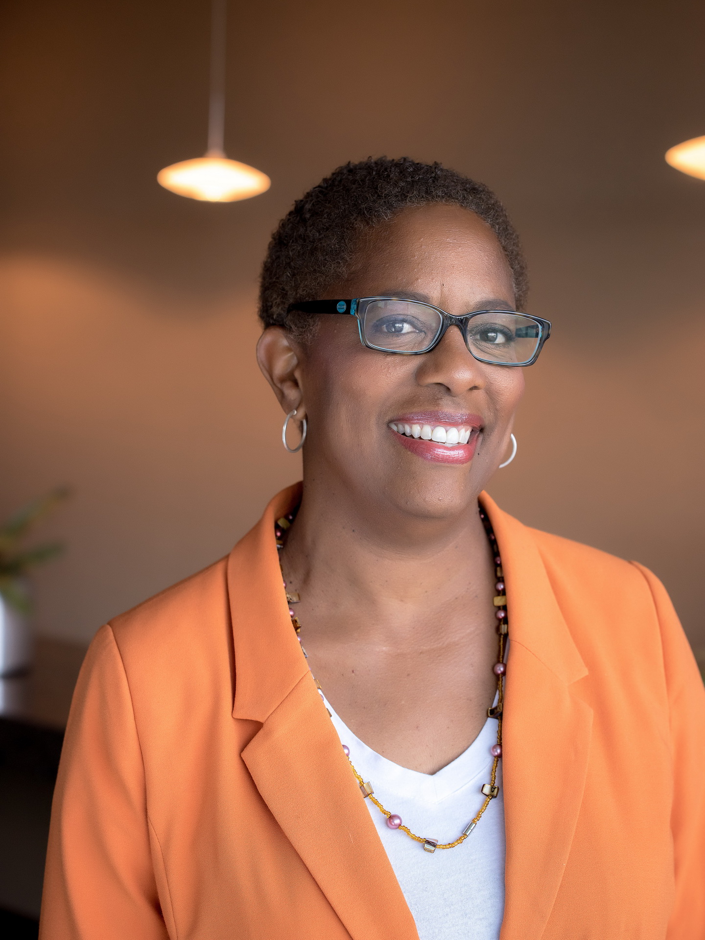 relaxed business headshot enviornmental portrait boardroom