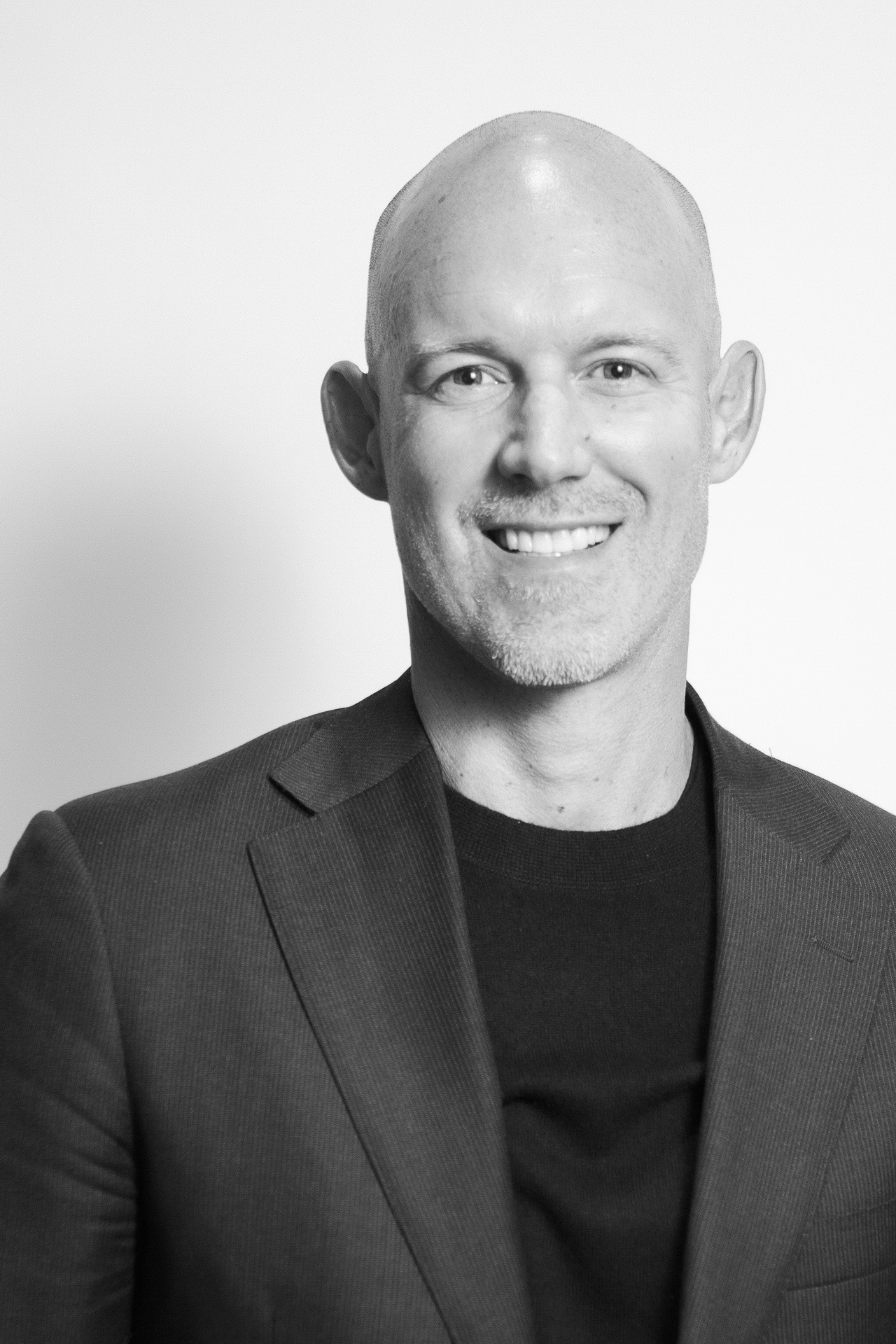 relaxed business headshot enviornmental portrait white backdrop modern